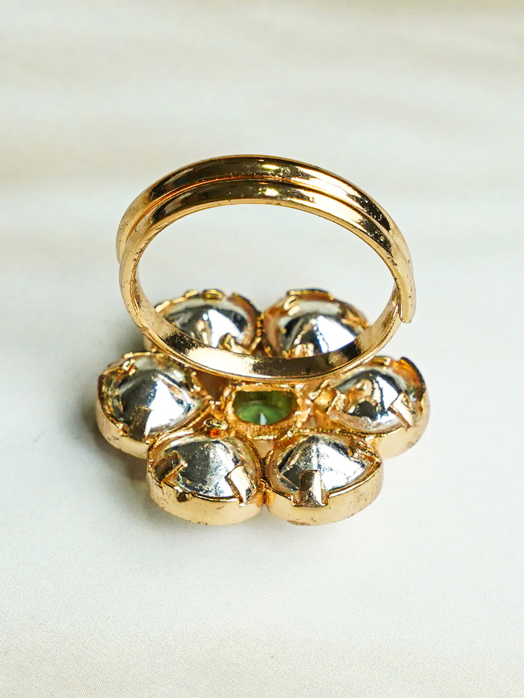 Zevar Club Gold-Toned White Kundan Studded Floral Adjustable Ring with Green Center Stone