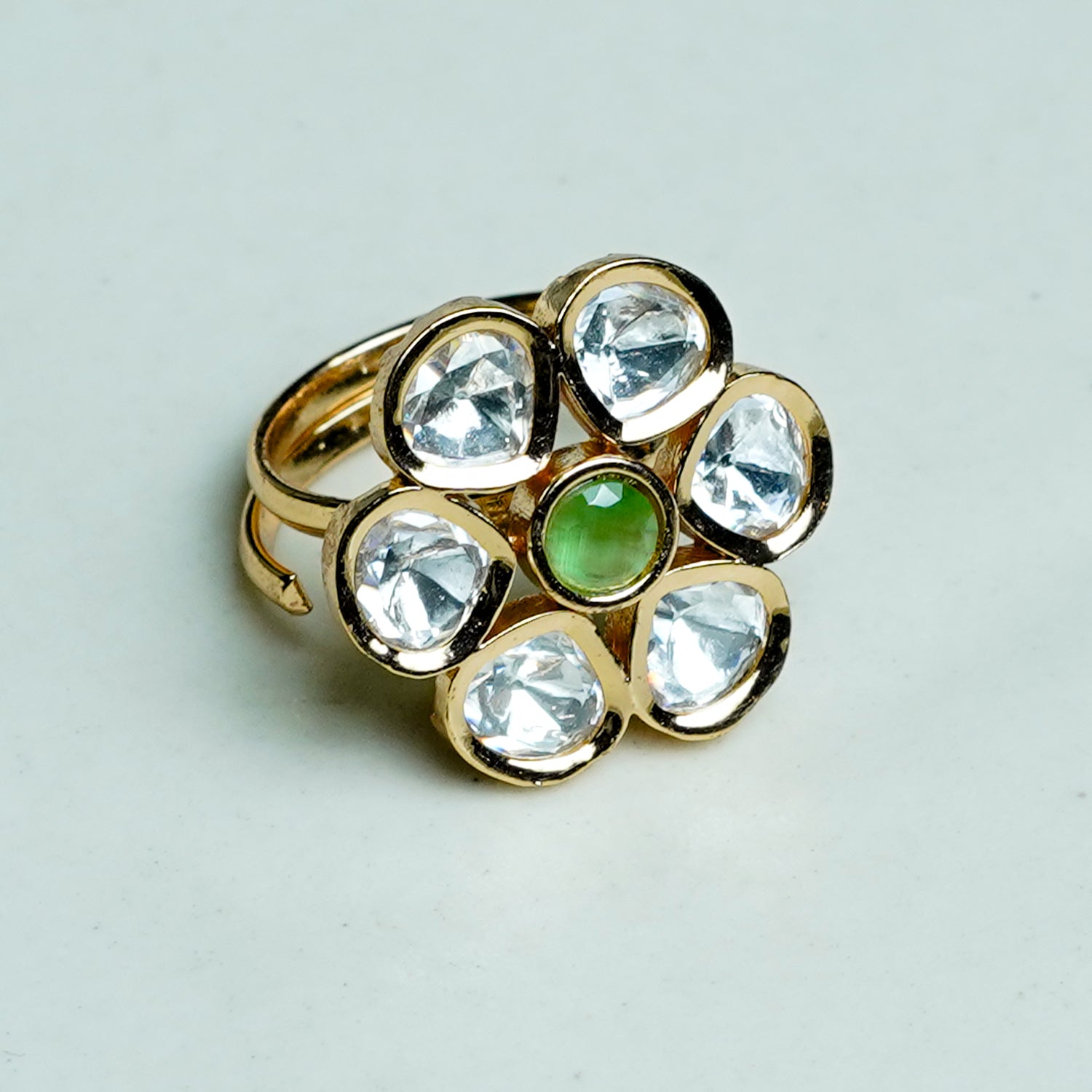 Zevar Club Gold-Toned White Kundan Studded Floral Adjustable Ring with Green Center Stone