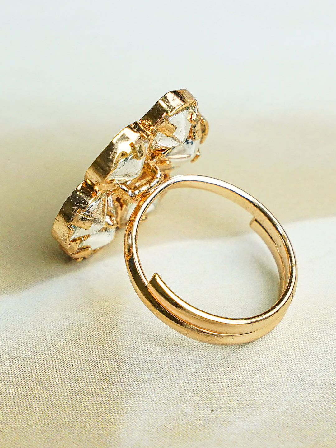 Zevar Club Gold-Toned White Kundan Studded Floral Adjustable Ring with Green Center Stone