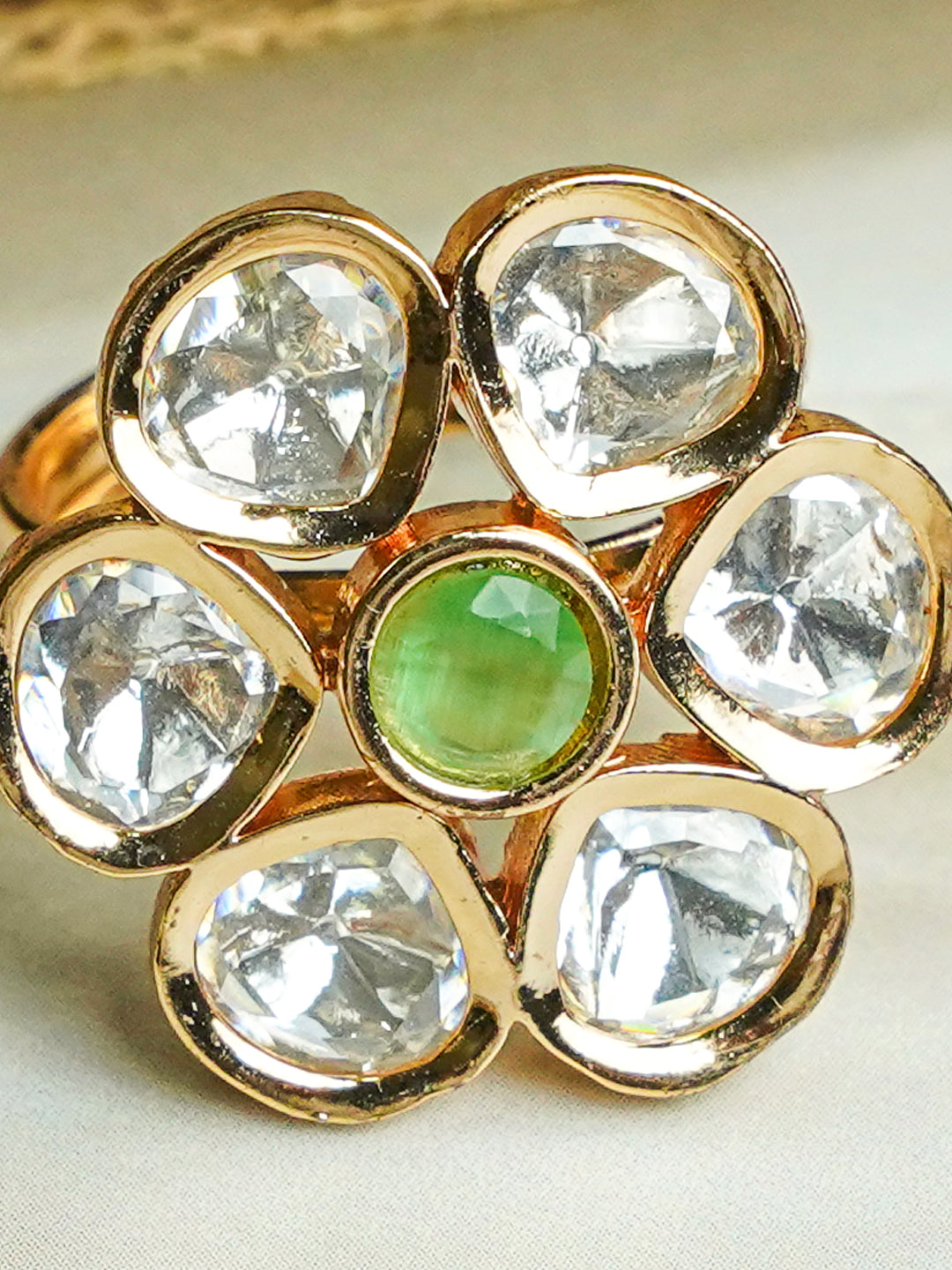 Zevar Club Gold-Toned White Kundan Studded Floral Adjustable Ring with Green Center Stone