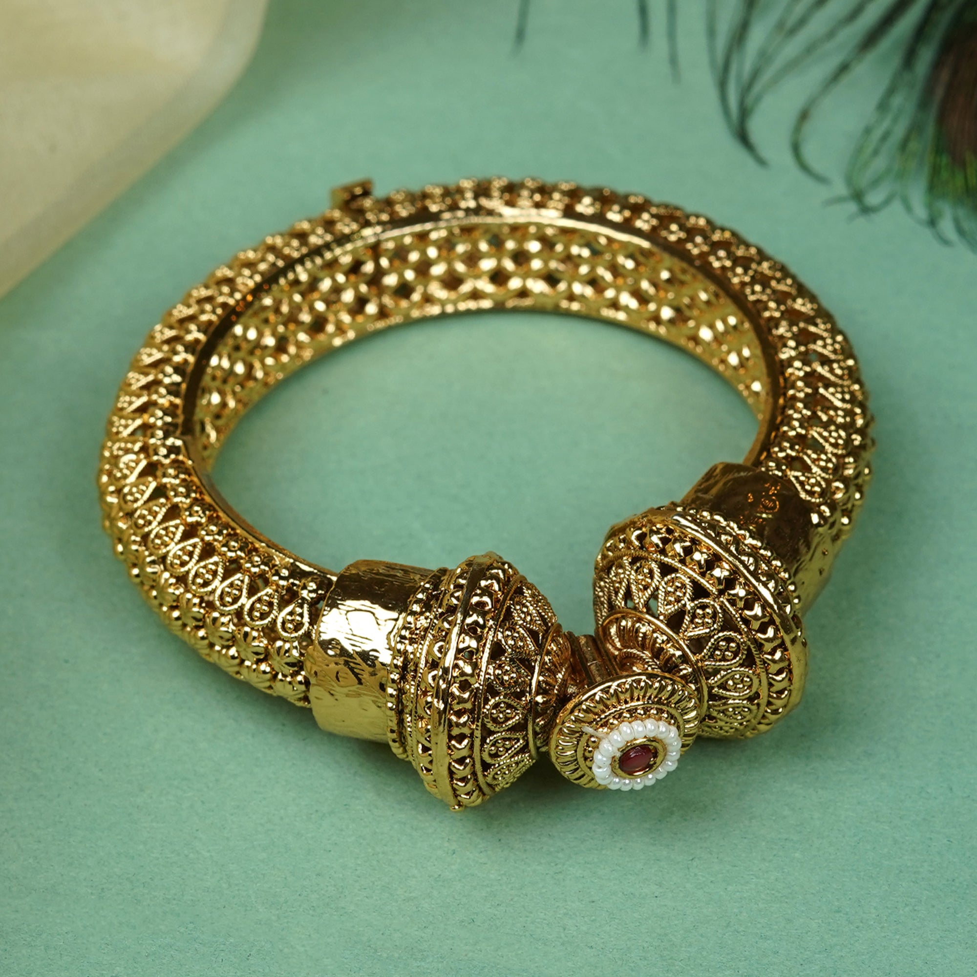Zevar Club 18K Gold Plated Handcrafted Rajwadi Kada Bangle with Dome Motif Ruby Red & White Stone Detailing