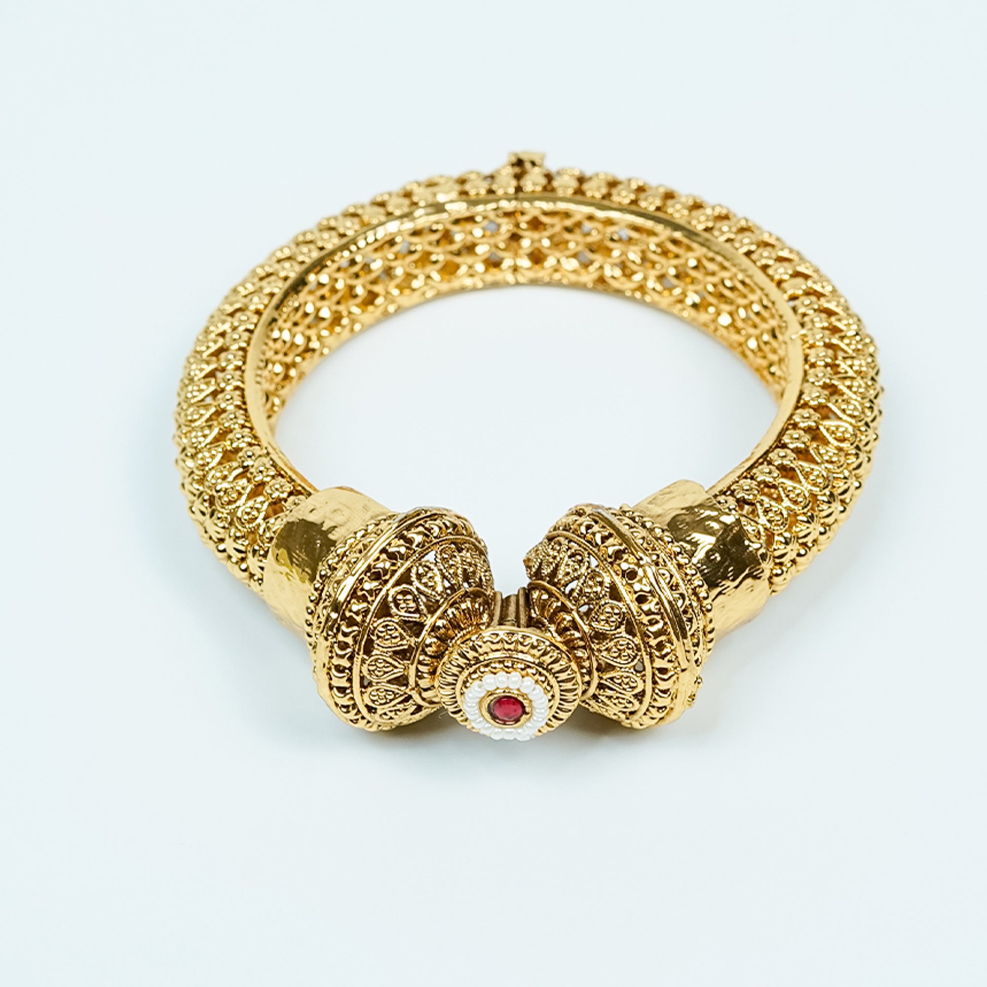 Zevar Club 18K Gold Plated Handcrafted Rajwadi Kada Bangle with Dome Motif Ruby Red & White Stone Detailing